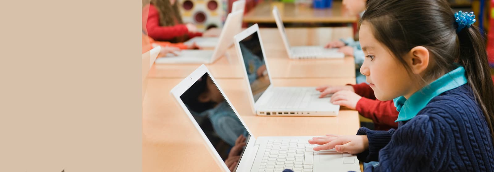 Young student using a laptop for digital learning in the classroom