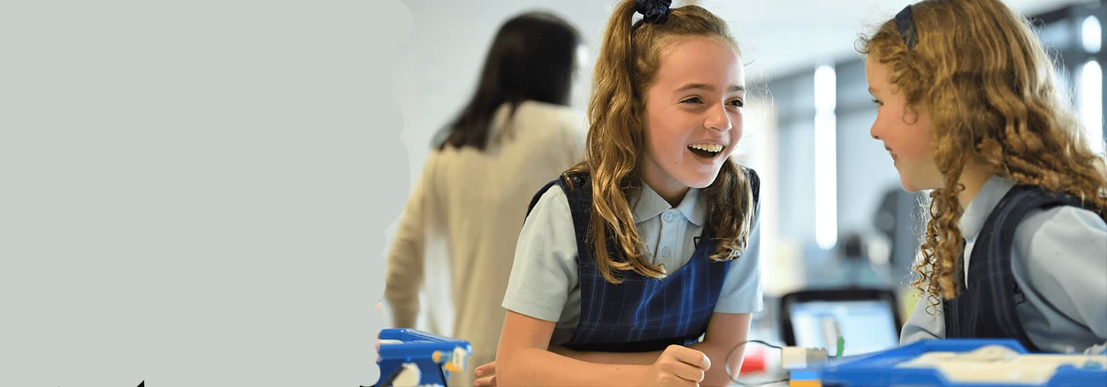 School students collaborating and learning together in a modern classroom