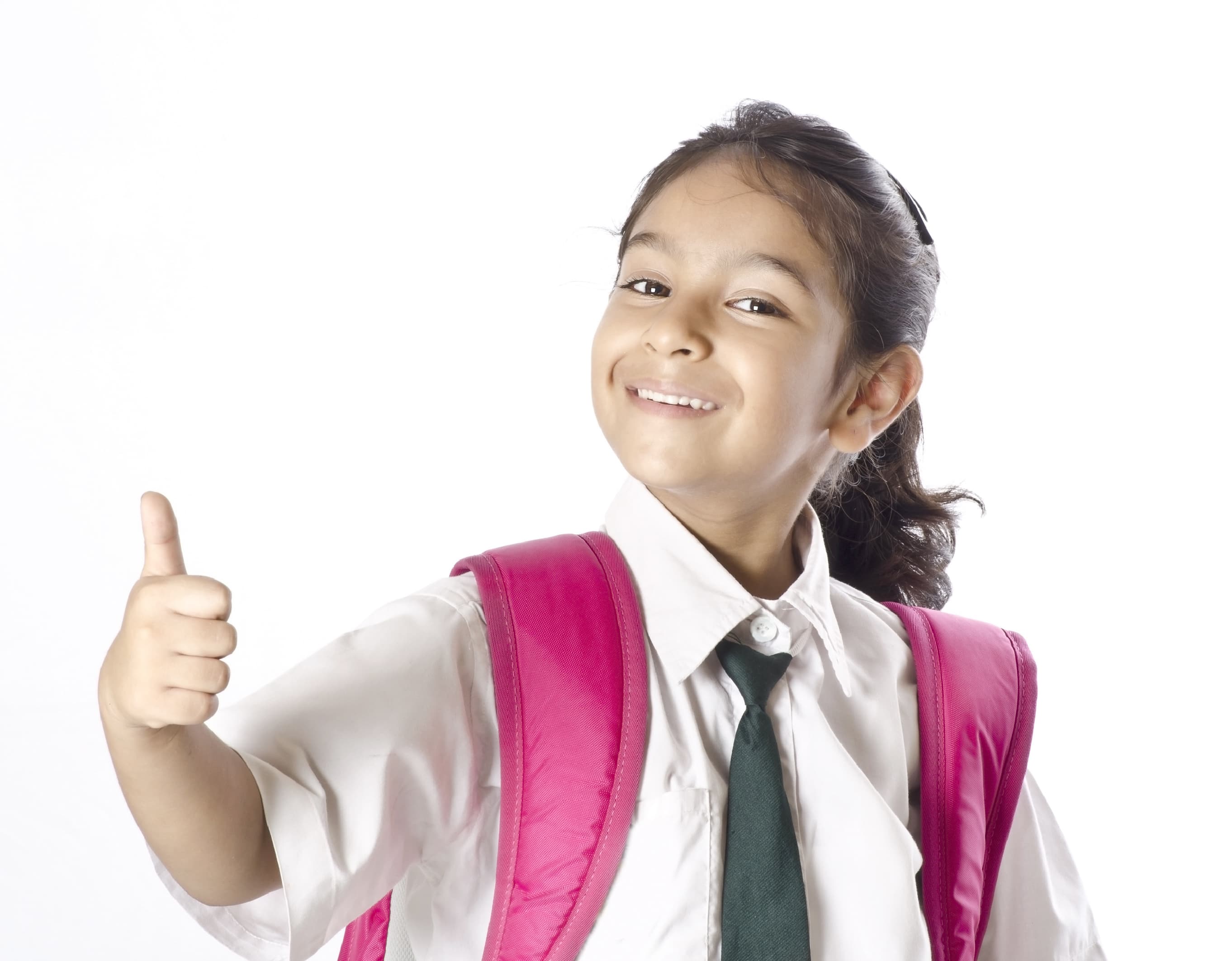 Smiling schoolgirl in uniform with backpack giving a thumbs-up