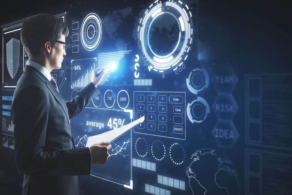 Businessman interacting with a futuristic digital data dashboard display